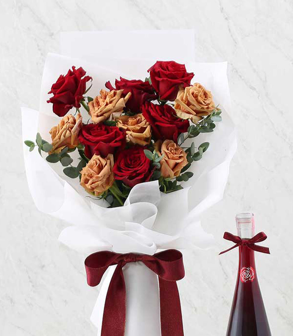 Premium red rose bouquet with red wine gift set, anniversary celebration flowers and wine pairing