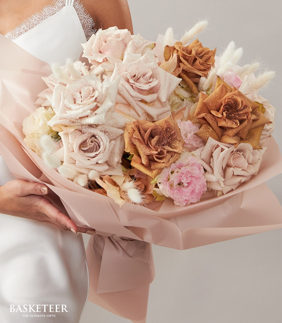 Dusty pink and cream roses with white dried flowers and balloons birthday gift bouquet