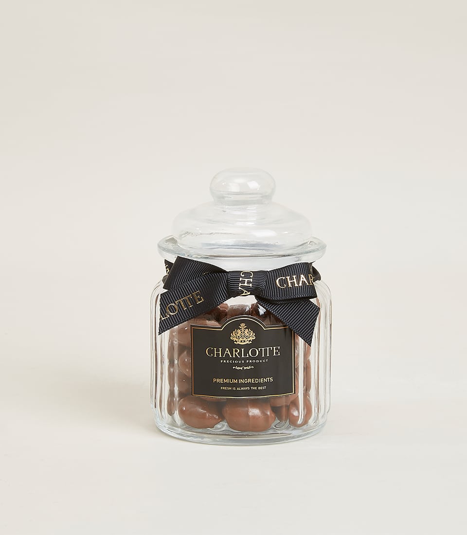 Glazed almond milk chocolate candies in premium glass jar with Charlotte Bakery ribbon