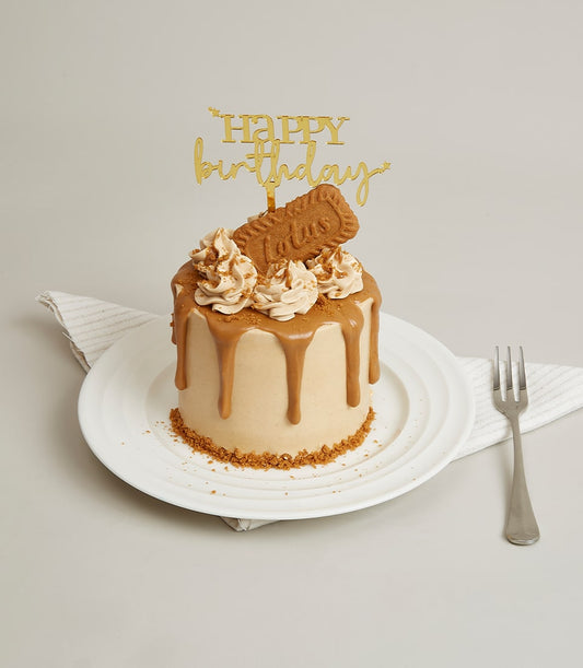 Lotus Biscoff and caramel mini cake with biscuit crumb base and golden birthday topper