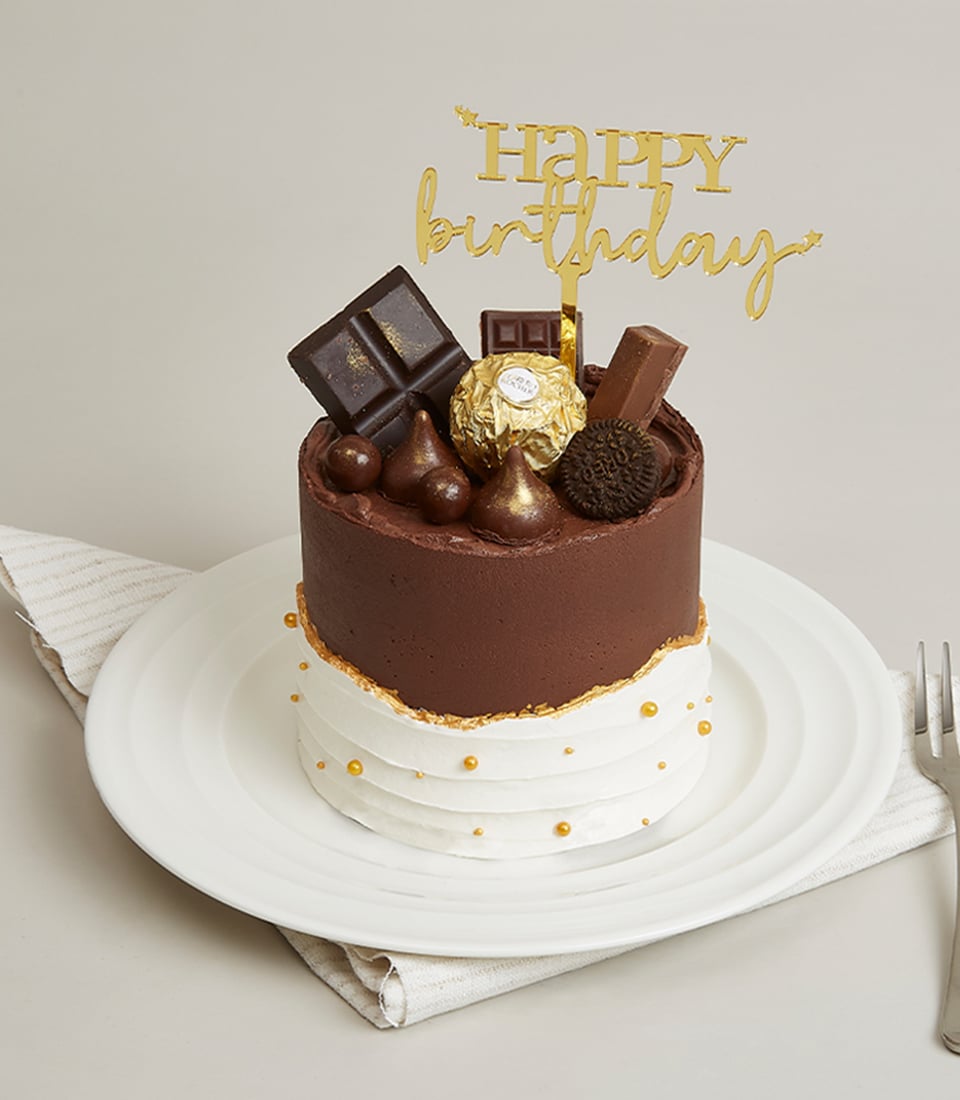 Two-tier mini chocolate and white cream cake with gold pearl details and chocolate decorations, perfect for gifting
