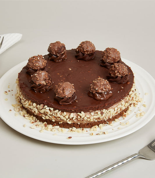 Ferrero Swirl Cheesecake with chocolate ganache, hazelnut-studded truffles, and chopped hazelnuts