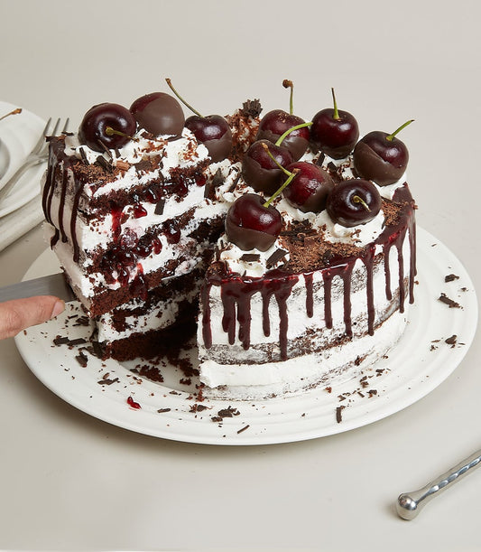 Black Forest cake with dark chocolate layers, cherry filling, and chocolate shavings for birthday celebrations