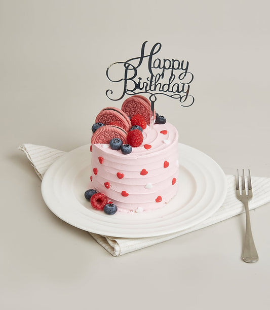 Basketeer Bangkok: A mini birthday cake add-on! Pink frosted cake with Oreo cookies, fresh berries, and a "Happy Birthday" topper. Perfect for a luxury gift basket.
