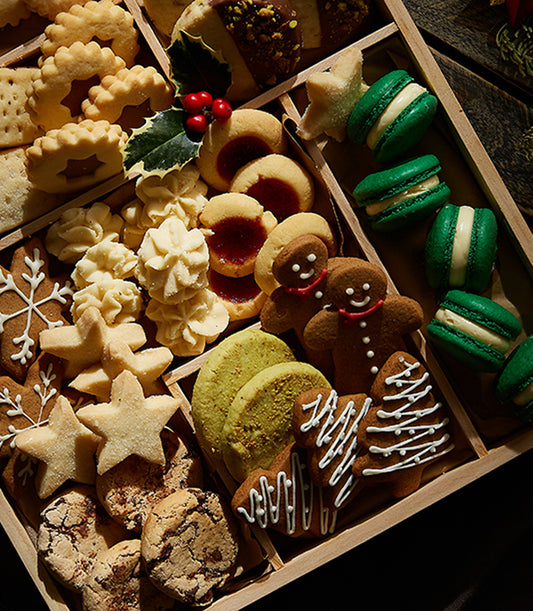 Grand Christmas Cookies Tray with shortbread, gingerbread, macarons, and jam-centered treats in wooden compartments
