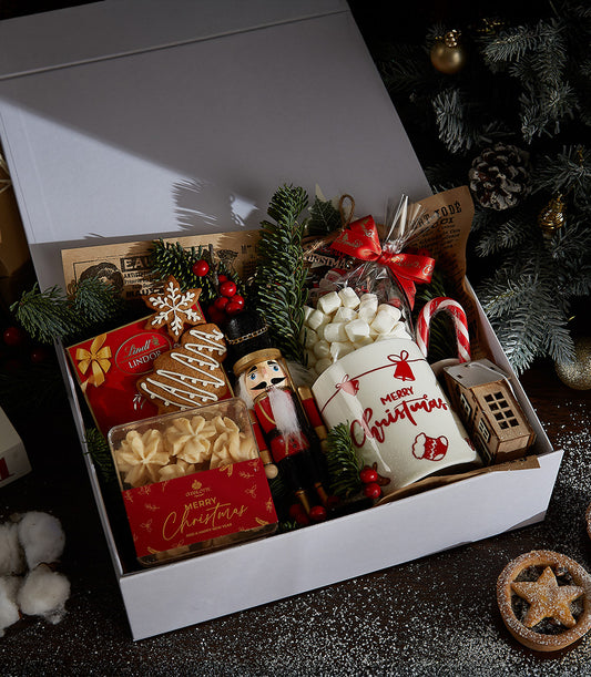 Festive Indulgence Christmas gift box with chocolates, gingerbread, cookies, nutcracker, and mug