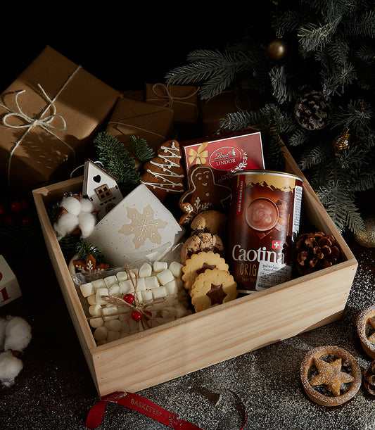 Winter Wonderland gift box with snowflake mug, hot chocolate, gingerbread cookies, and marshmallows