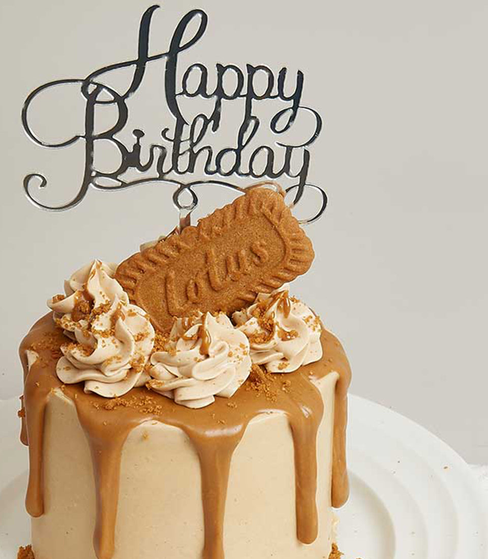Charlotte Bakery artisan birthday cake, a single round tier with smooth buttercream,