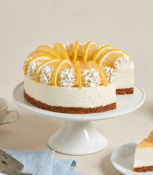 Charlotte Bakery's artisan round lemon cheesecake, topped with fresh lemon slices and