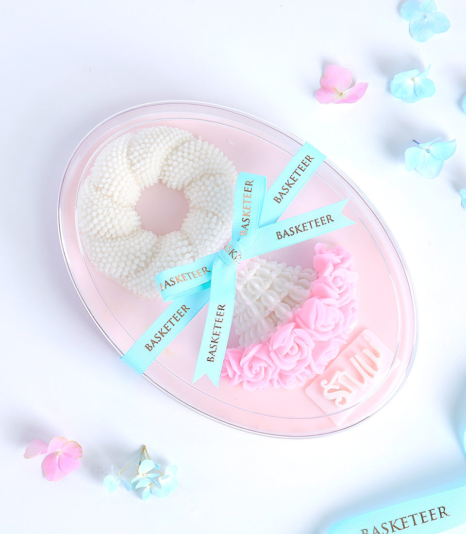 Mother's Day jelly garland gift set with pink roses and white beaded Thai-inspired design in oval container