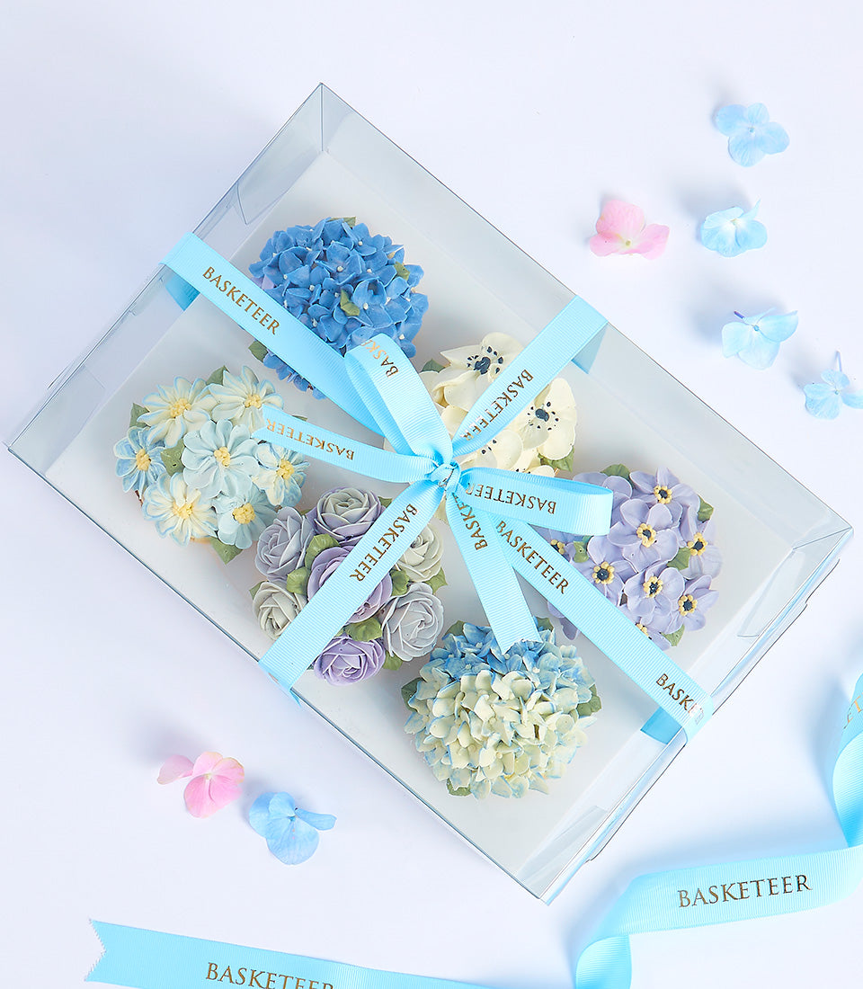 Pastel floral buttercream cupcakes in gift box with blue ribbon, Mother's Day bakery gift