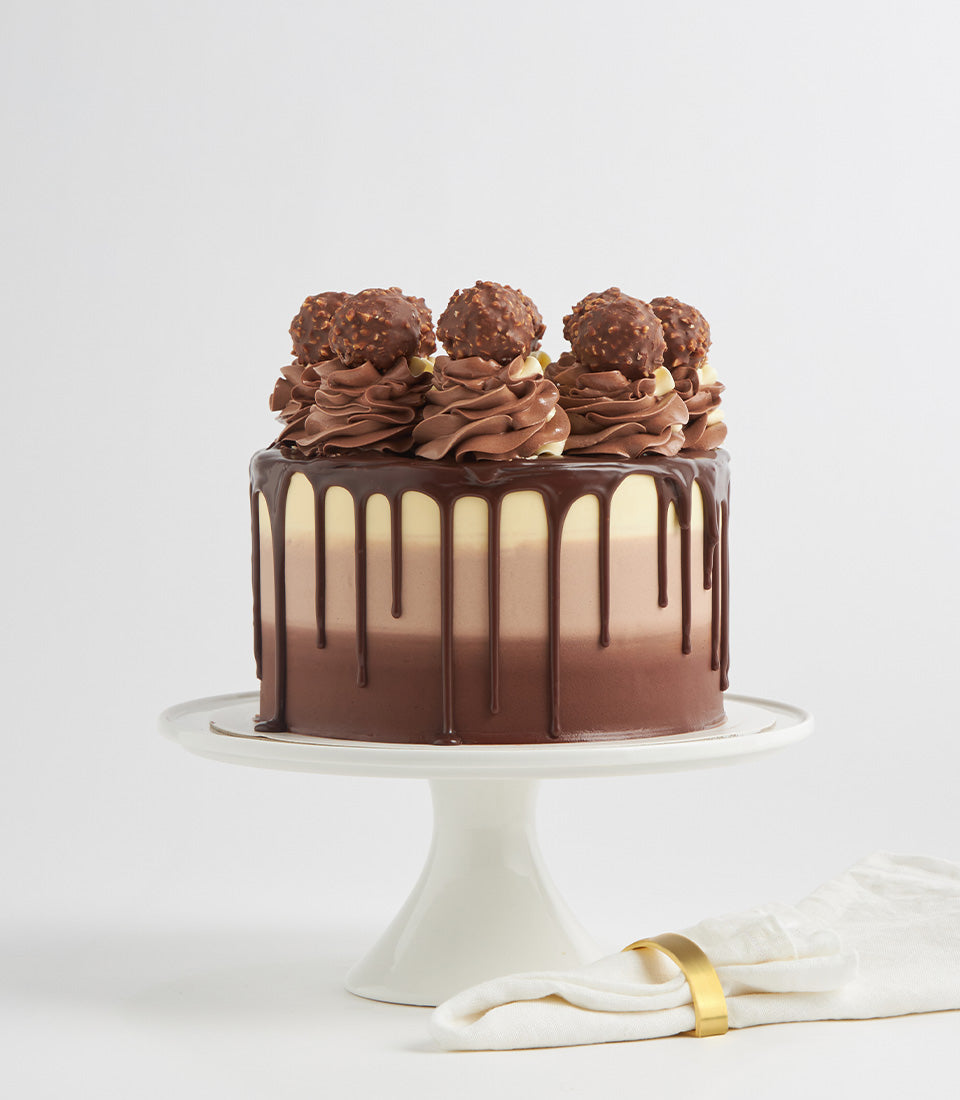 Ferrero Biscoff Bliss three-tier chocolate ombre cake with ganache drip and hazelnut truffles