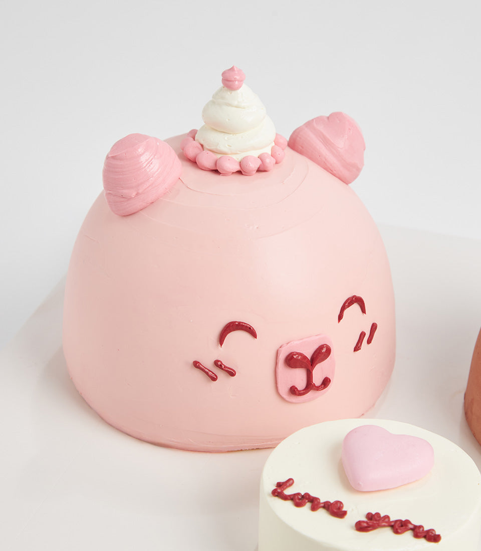Little Bear mini celebration cakes with pink frosting and character face design, artisan baked by Charlotte Bakery