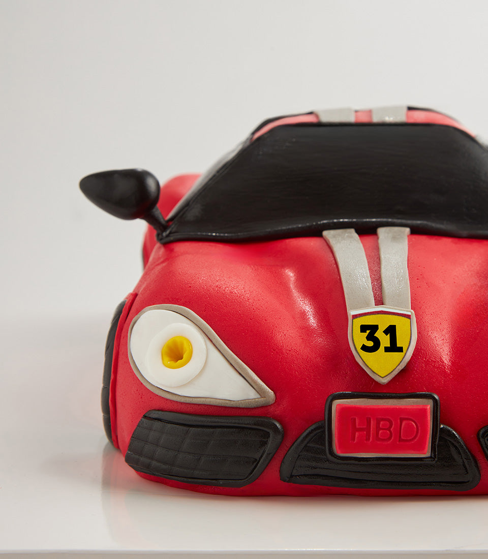 Red sports car birthday cake with racing stripes and custom number detail, 4 lb vanilla celebration cake