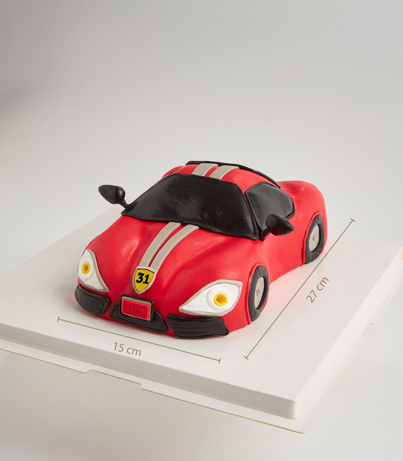 Red sports car fondant cake with black details and racing stripes, custom birthday cake design for men