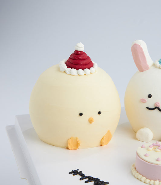 Mini animal character cakes with chick and bunny designs, artisan birthday celebration cakes