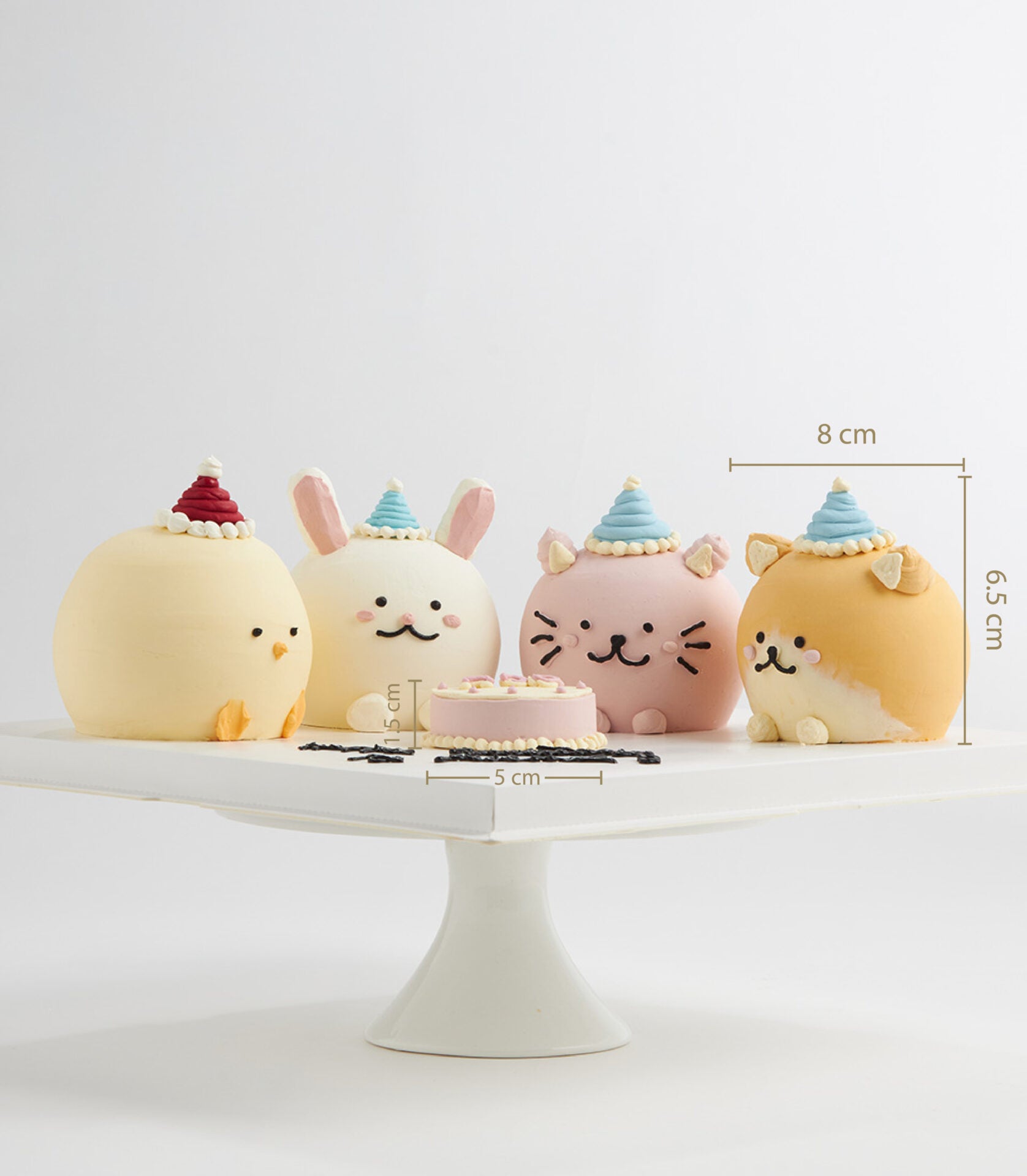 Adorable mini animal birthday cakes with party hats on pedestal stand, artisan celebration cake gift set for kids