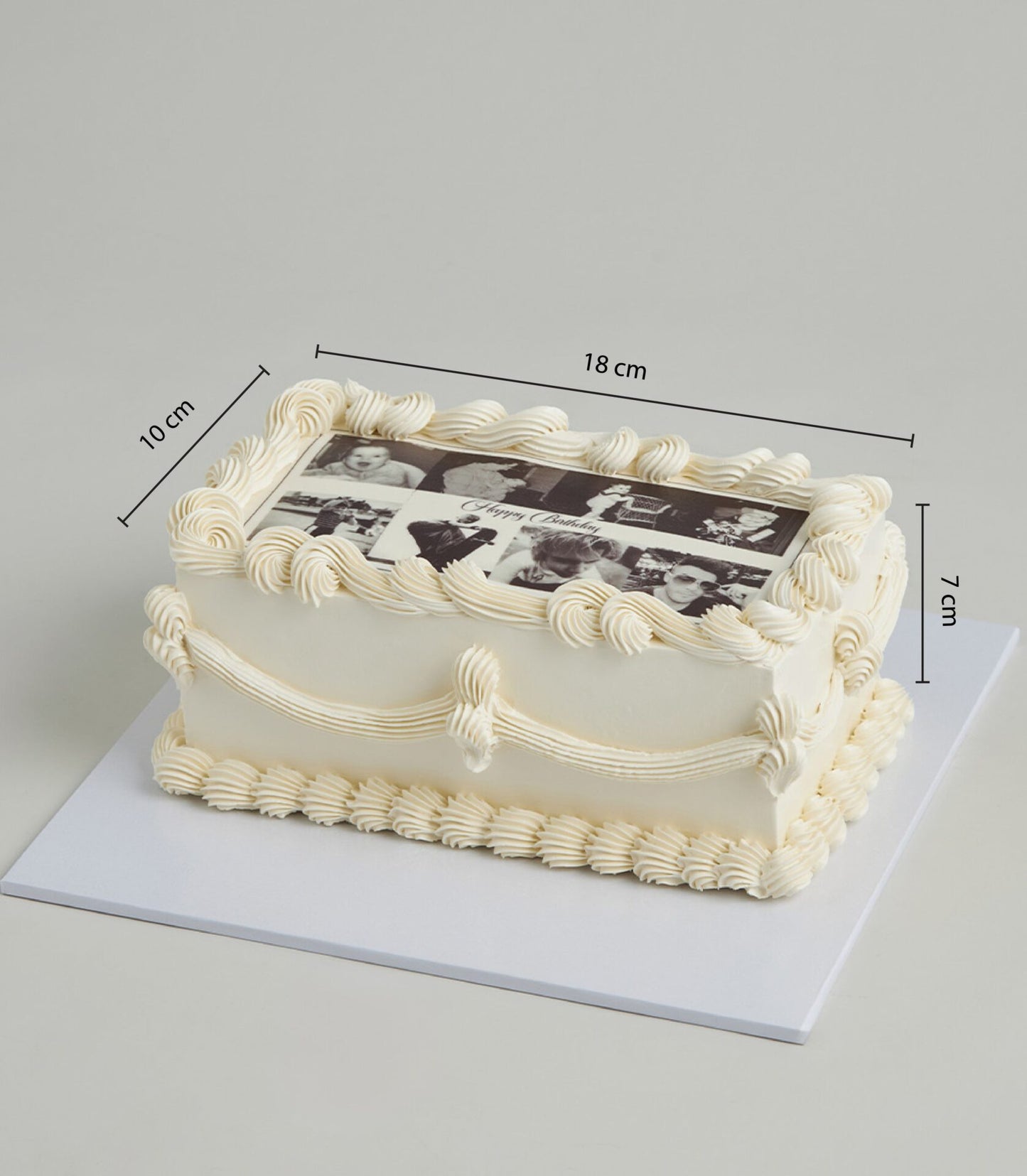 Rectangular lemon zest celebration cake with edible photo collage and custom birthday message, cream frosting and piped