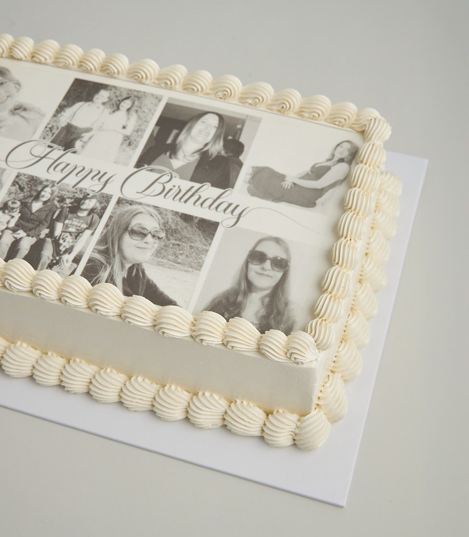 Personalised vanilla layer cake with edible photo collage and Happy Birthday message, cream frosting and piped rosettes