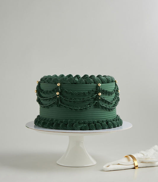 Charlotte Bakery custom cake: Emerald green buttercream birthday cake delivery Bangkok, vintage piped draping and gold pearl accents.