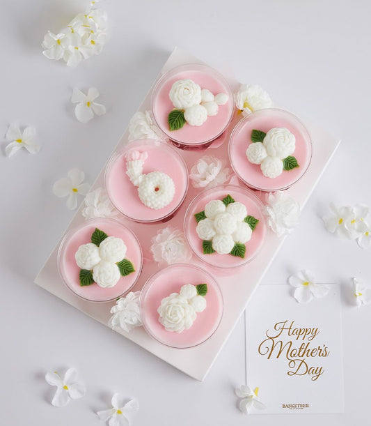 Mini coconut jelly desserts with white floral decorations in clear cups, Mother's Day gift set