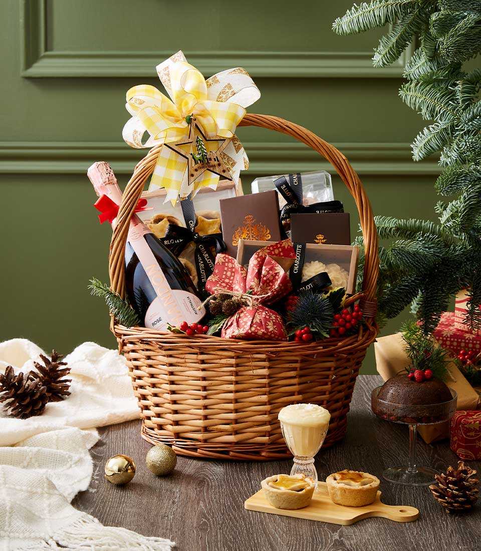 Chandon Rosé sparkling wine luxury Christmas hamper with gourmet treats, gold-trimmed boxes, and festive wicker basket