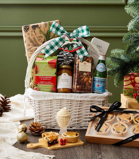 Festive Christmas wellness gift basket with premium teas, gourmet treats, and Charlotte Bakery mince pies