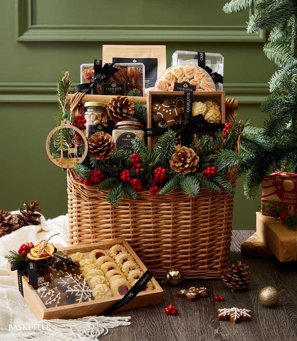 Opulent Christmas desserts gift basket with gingerbread, cookies, and festive treats in wicker with pine branches