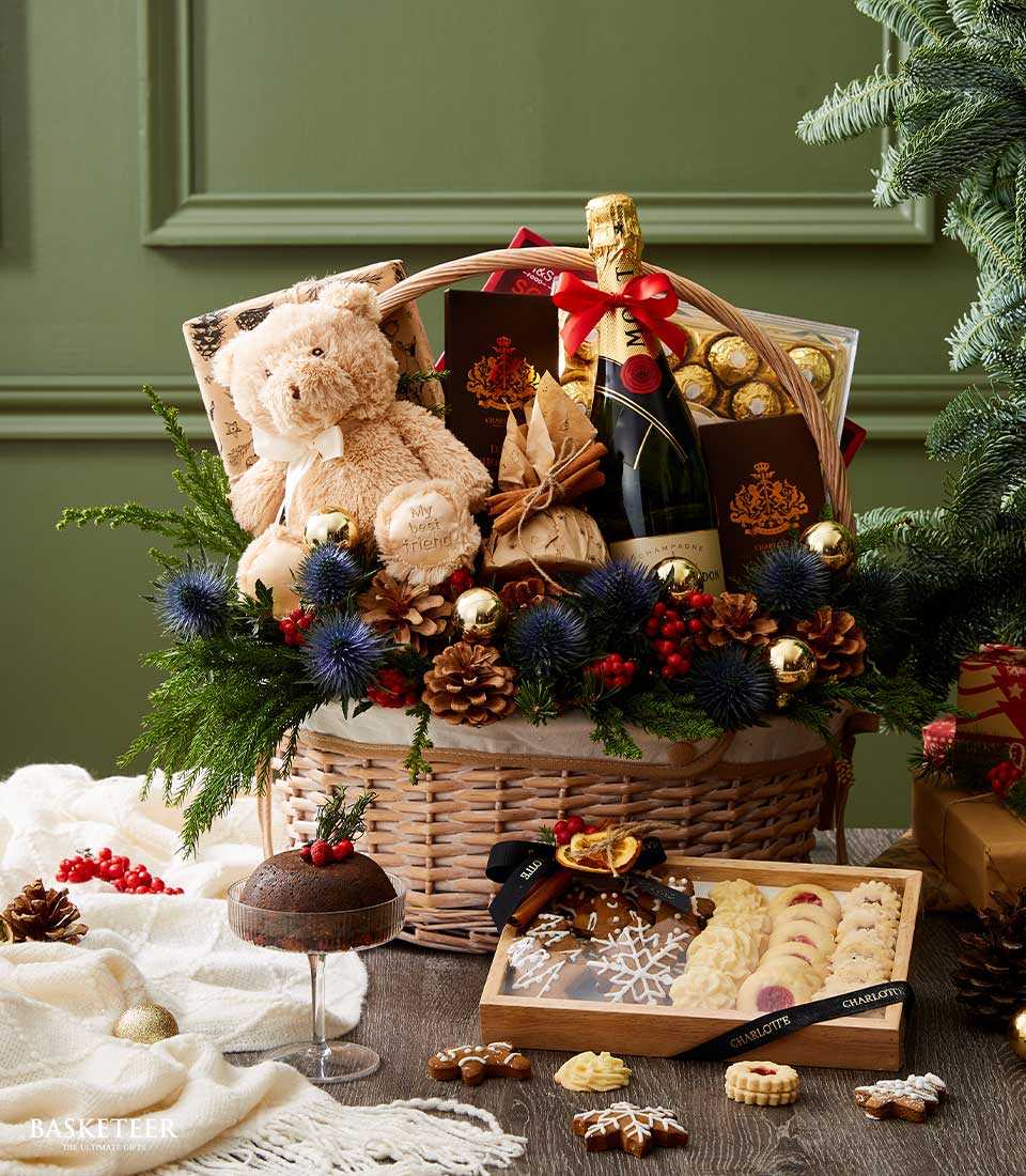 Luxury Christmas gift basket with Moët champagne, teddy bear, chocolates, and festive holiday treats