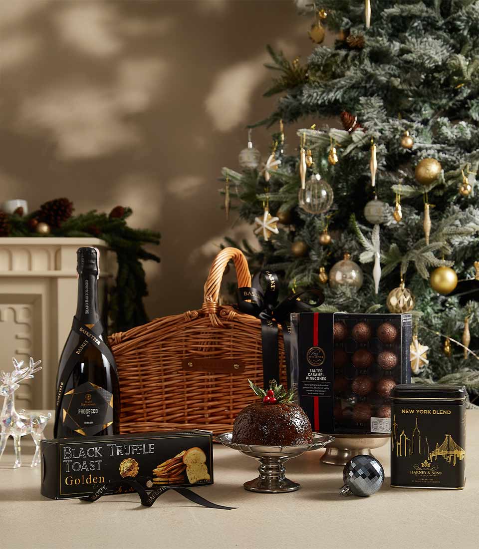 Luxury black Christmas hamper with prosecco, truffle toast, pudding, caramel chocolates, and festive accessories