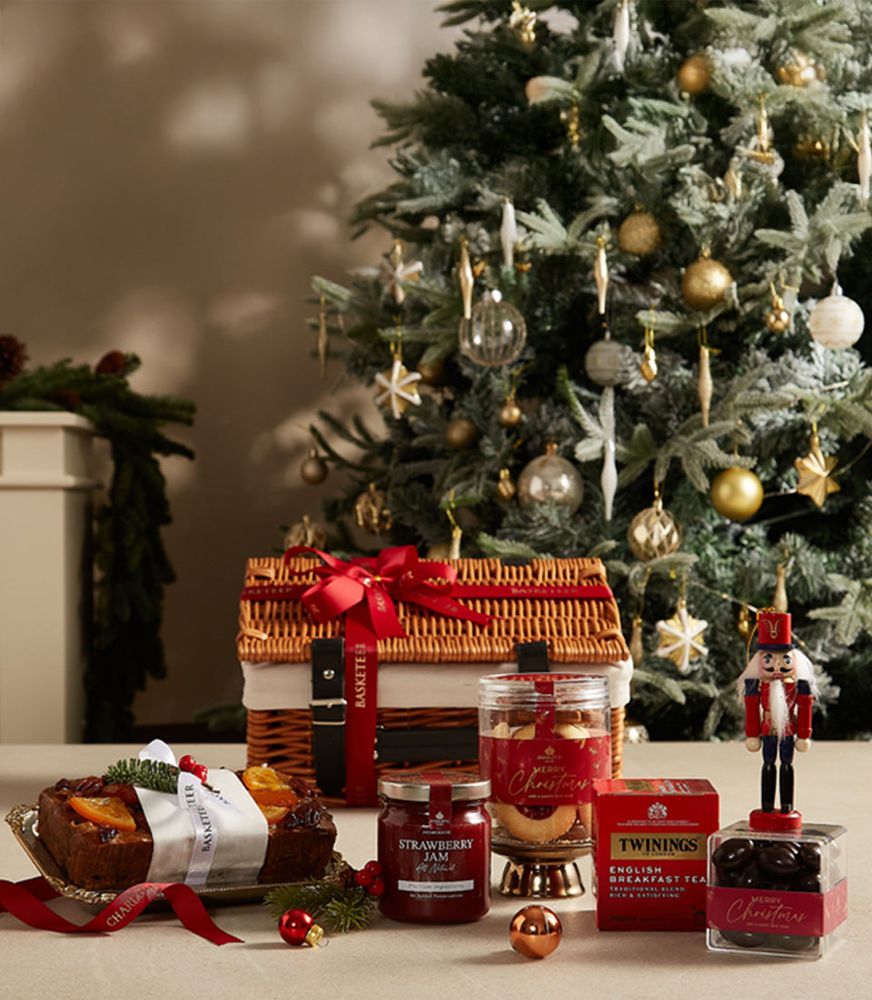 Premium Christmas hamper with fruit cake, jam, tea, chocolates and gourmet treats in wicker basket