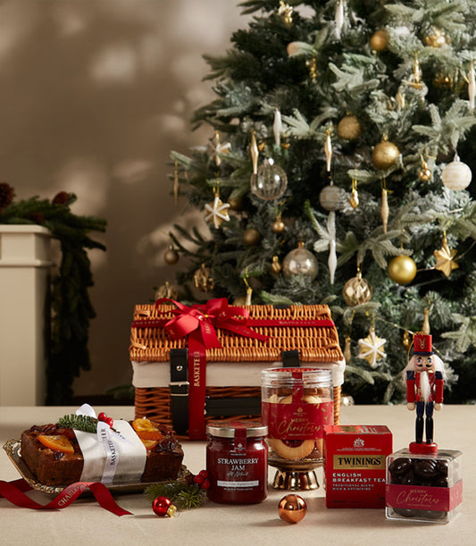Premium Christmas hamper with fruit cake, jam, tea, chocolates and gourmet treats in wicker basket