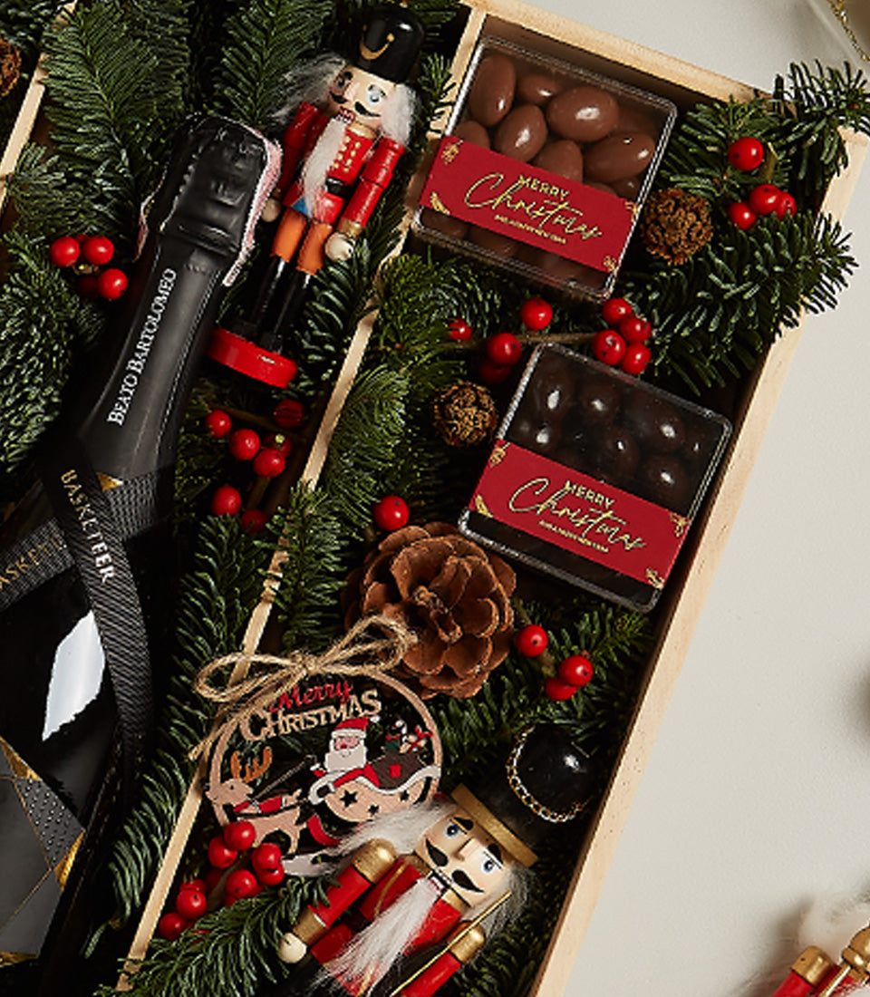 Festive Cheer Deluxe Christmas gift box with prosecco, nutcracker, chocolates, and pine greenery
