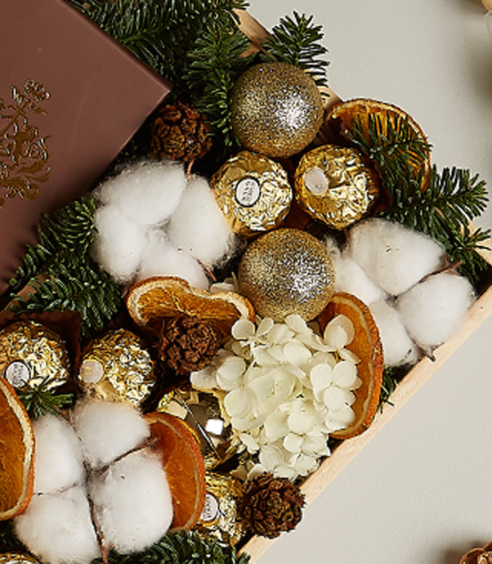 Golden Elegance festive gift box with prosecco, gold chocolates, and holiday botanicals in wooden tray