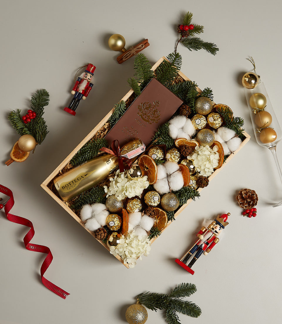 Golden Elegance festive gift box with Prosecco, Ferrero Rocher chocolates, and holiday decorations