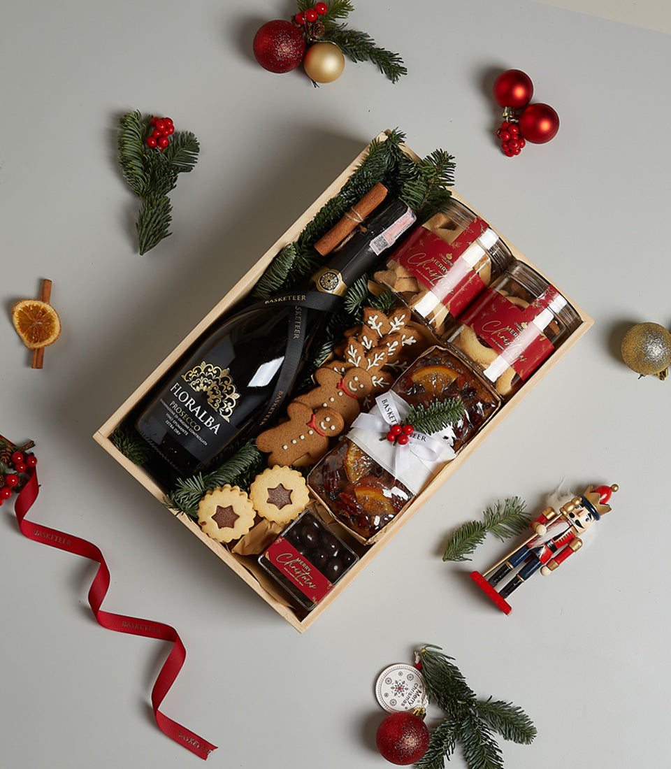 Floralba Prosecco holiday gift set with gingerbread, fruit cake, and festive treats in wooden crate