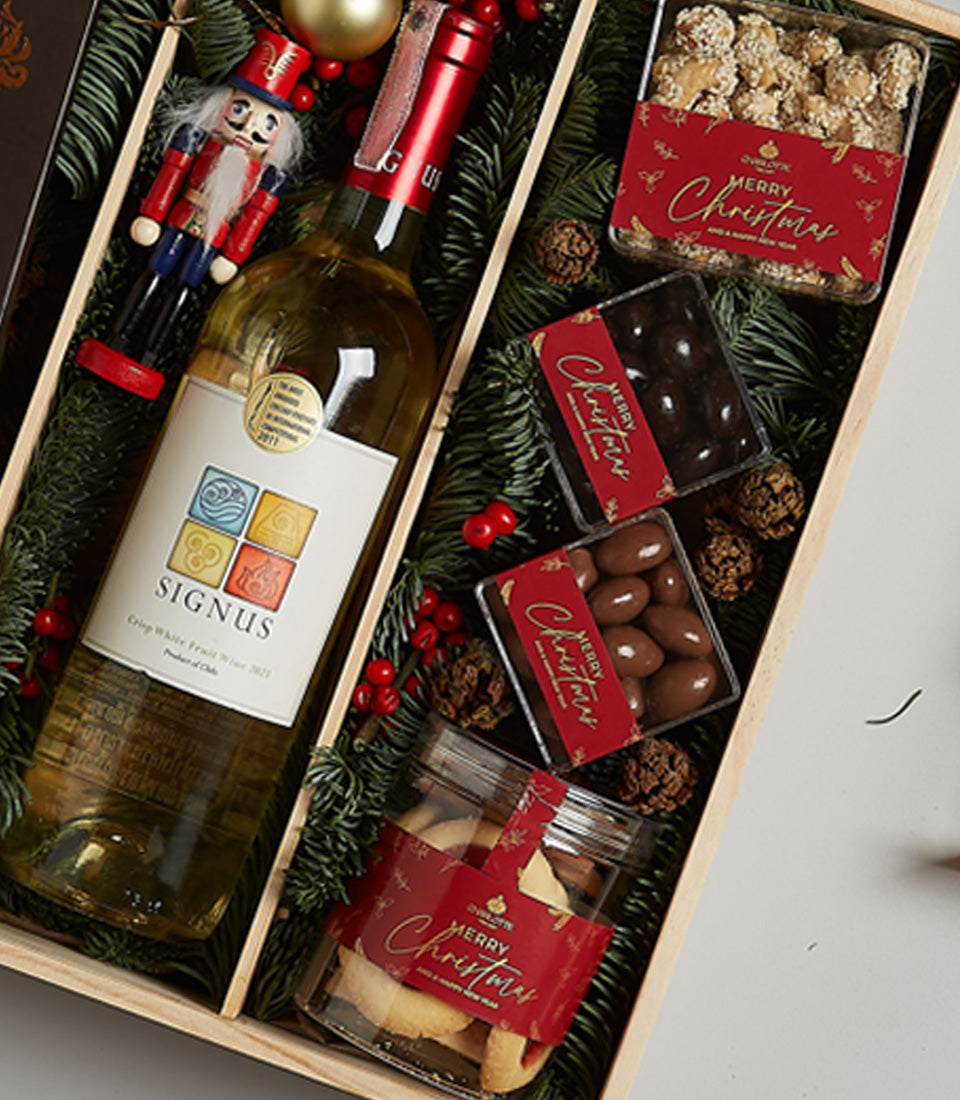 Festive white wine hamper with Chilean Crisp White Fruit Wine, nutcracker figurine, and Christmas treats in luxury gift box
