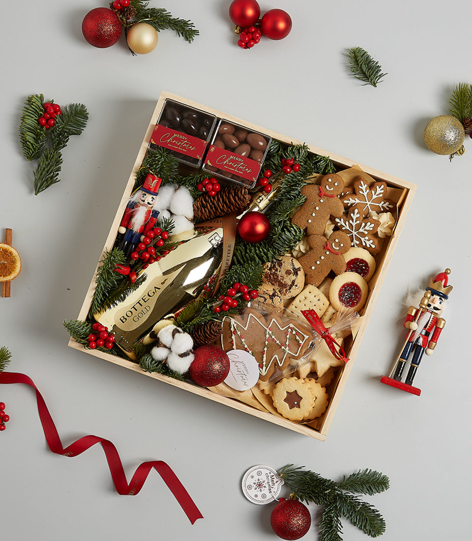 Golden Indulgence Christmas treat box with Prosecco, artisan chocolates, and festive cookies