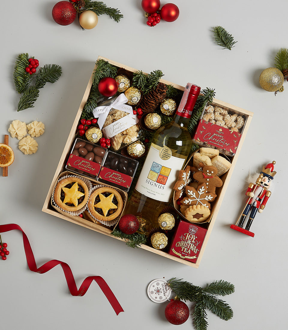 Premium white wine Christmas hamper with mince pies, chocolates, and festive treats in wooden crate