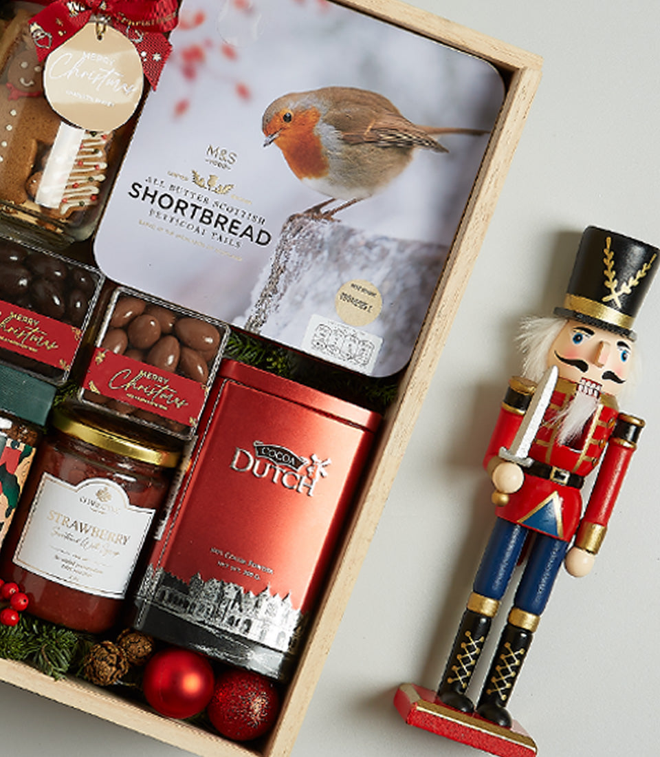 Moët & Champagne Christmas hamper with Scottish shortbread, preserves, chocolates, and festive nutcracker decoration