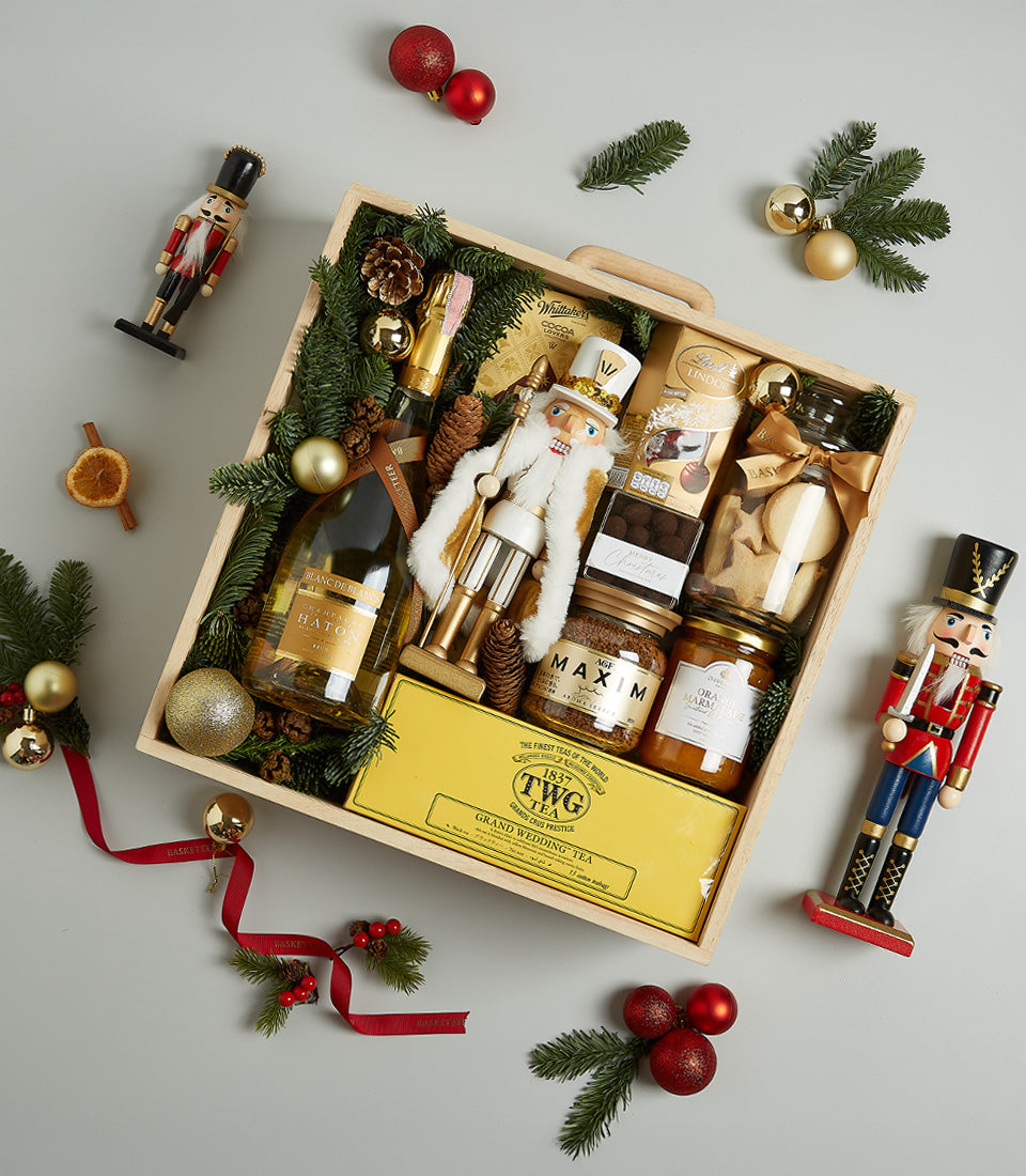 Festive Golden Delights luxury hamper with prosecco, gourmet chocolates, and artisan treats in wooden crate for Christmas