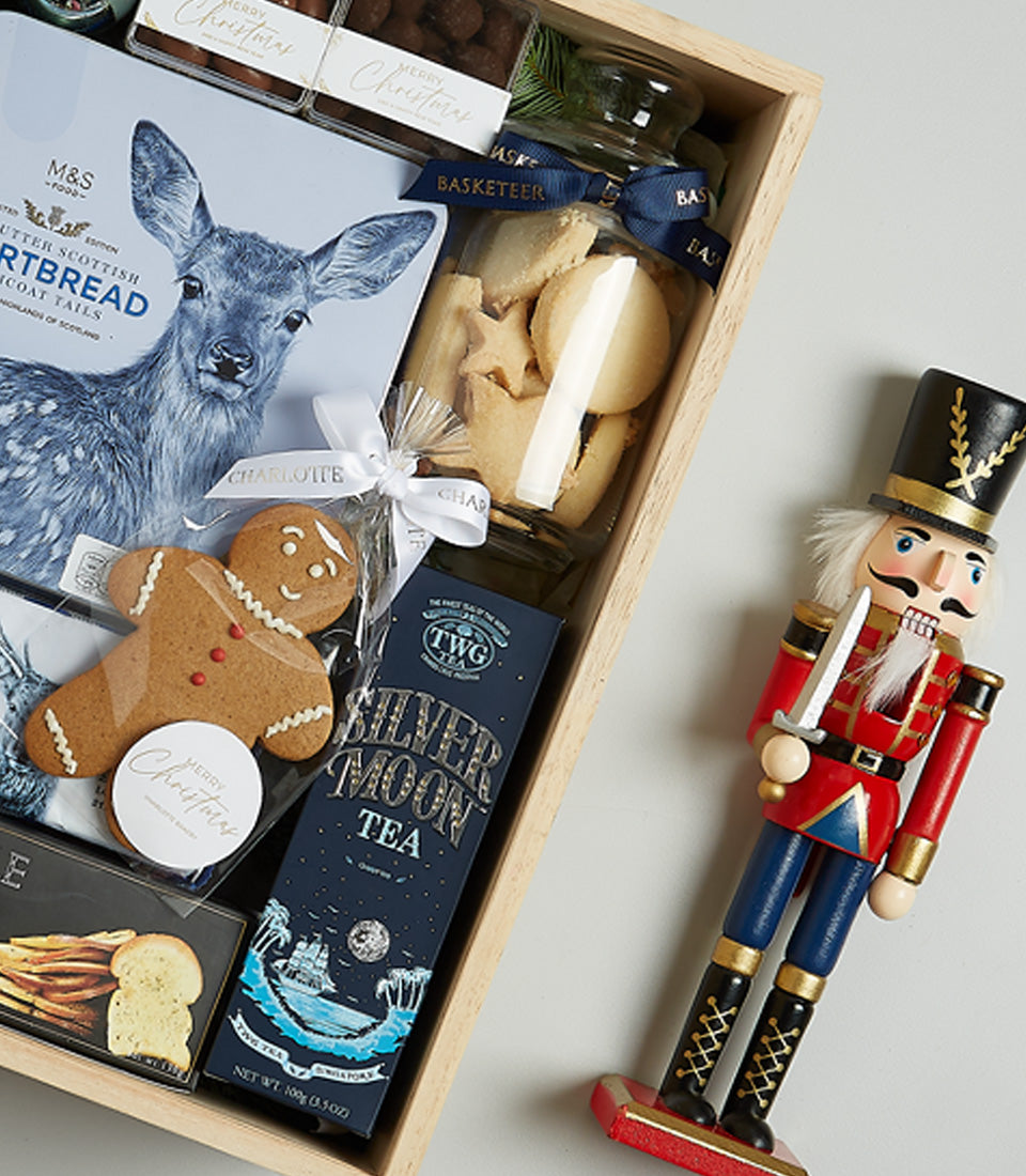 Starlight Blue Christmas gift hamper with red wine, gourmet shortbread, tea, and festive treats in wooden crate