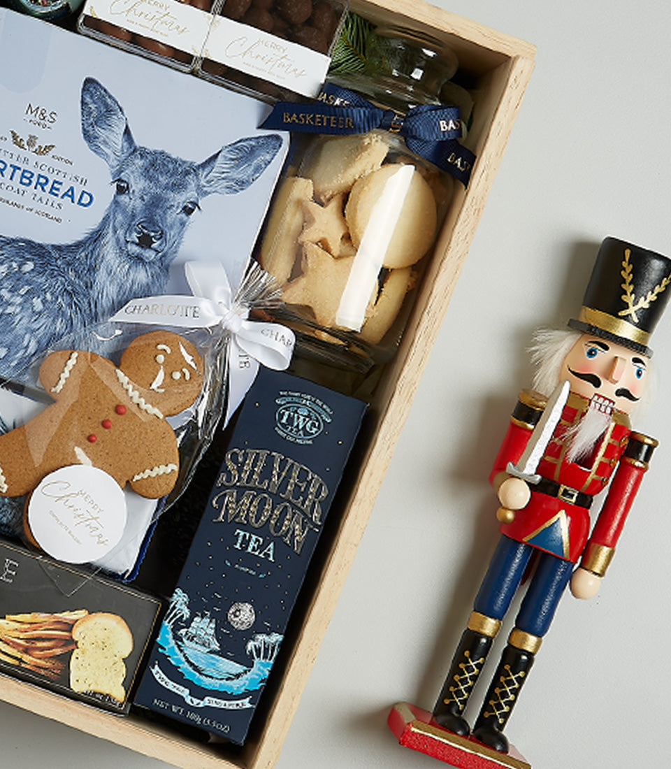Midnight Elegance Christmas gift basket with prosecco, gourmet shortbread, Silver Moon tea, and festive gingerbread treats