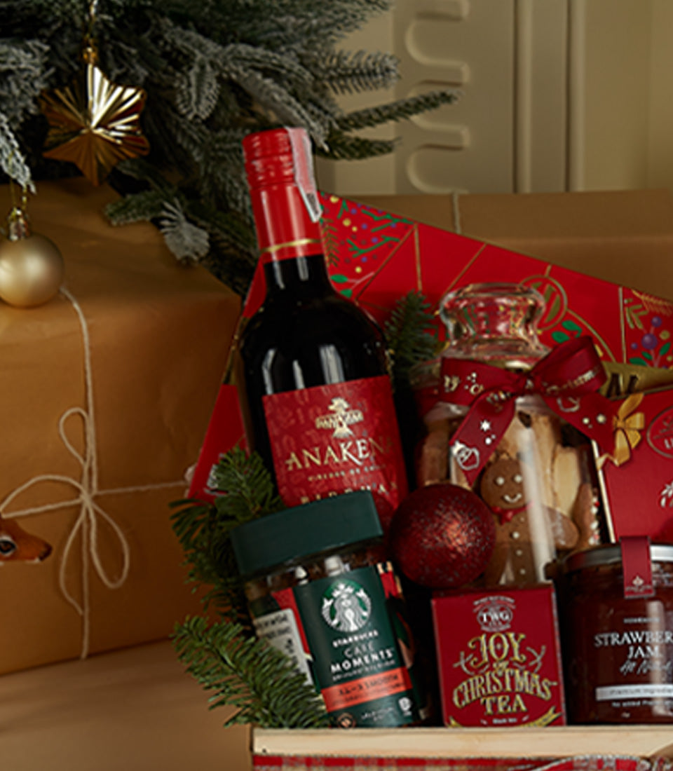 Luxury Christmas wine hamper with Anaken red wine, gourmet coffee, festive cookies, and artisan spreads in wooden crate