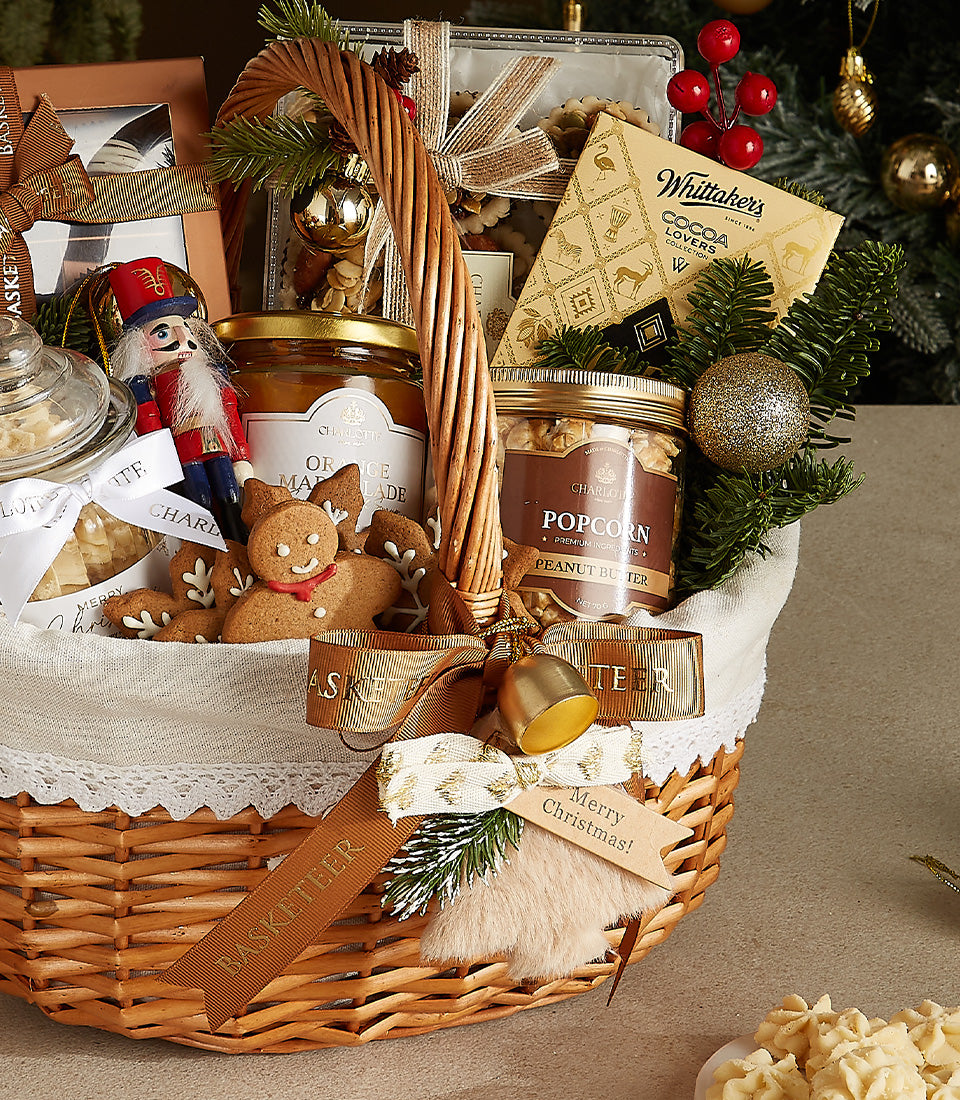 Woven wicker Christmas gift basket with gourmet marmalade, peanut butter, Whittaker's chocolates, gingerbread cookies, and