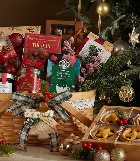 Merry Deluxe Christmas Gift Basket with gourmet treats, tiramisu, coffee, and shortbread in wooden basket with green plaid