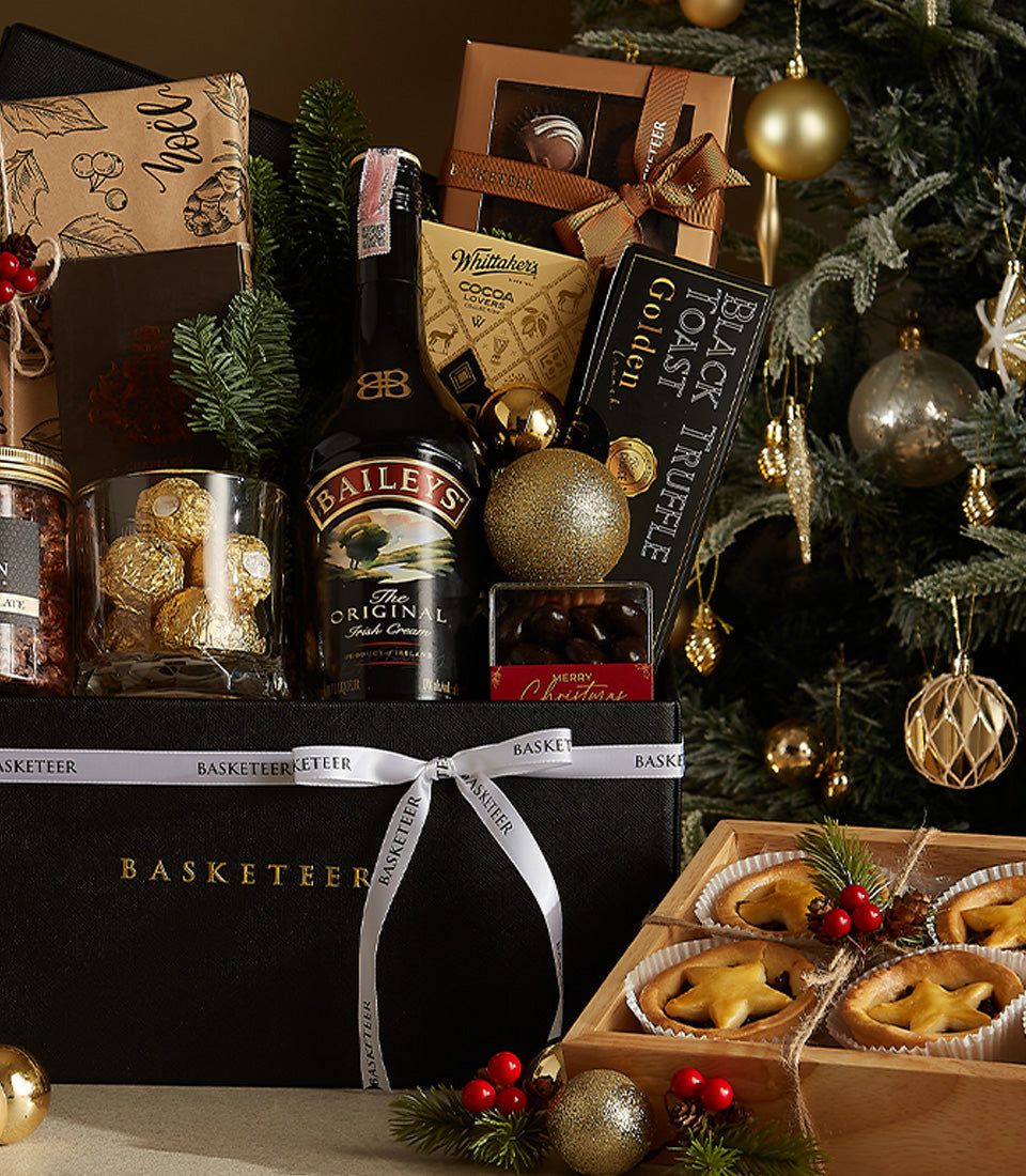 Luxurious black box Christmas hamper with Baileys Irish Cream, Ferrero Rocher chocolates, and festive gold accents