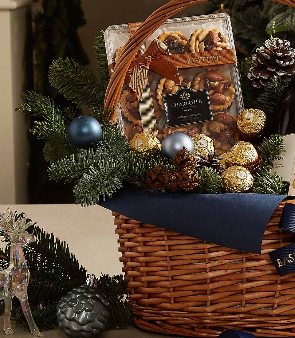 Champagne celebration gift basket with prosecco, Charlotte bakery treats, Ferrero Rocher chocolates, festive pine branches