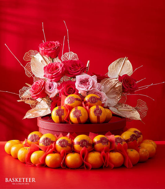 Blooming Prosperity red gift box with fresh roses, gold foliage, and ribbon-wrapped mandarins for Chinese New Year