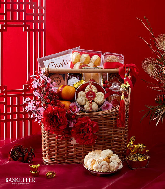 Royal Mandarin Sweets festive gift basket with pineapple pies, cookies, honey, fresh oranges, and red peonies for Chinese